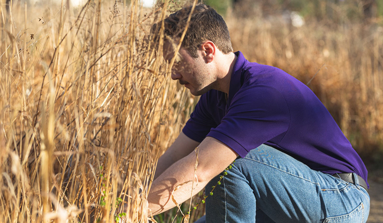A student works on something in a field.