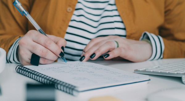 Woman writing in a notebook