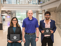 From left, Nandini Sarkar, Dean Darren Dawson, and Joydeep Mitra