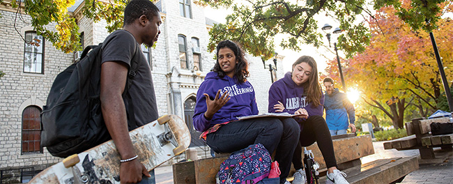 Students studying on campus between classes